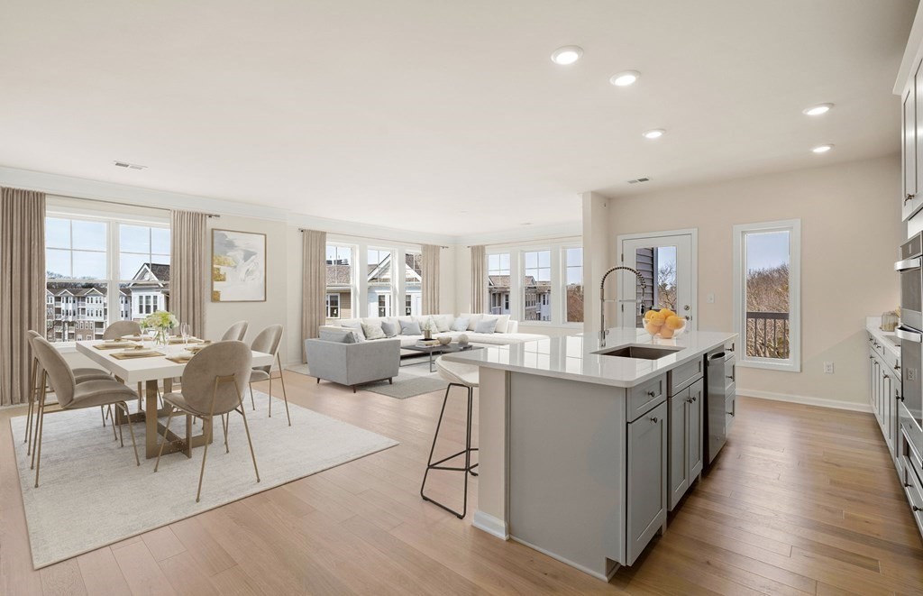 2 Stratton Drive, Unit 305 Woburn, MA 01801 - Photo 3 of 15 a large kitchen with lots of counter top space and stainless steel appliances