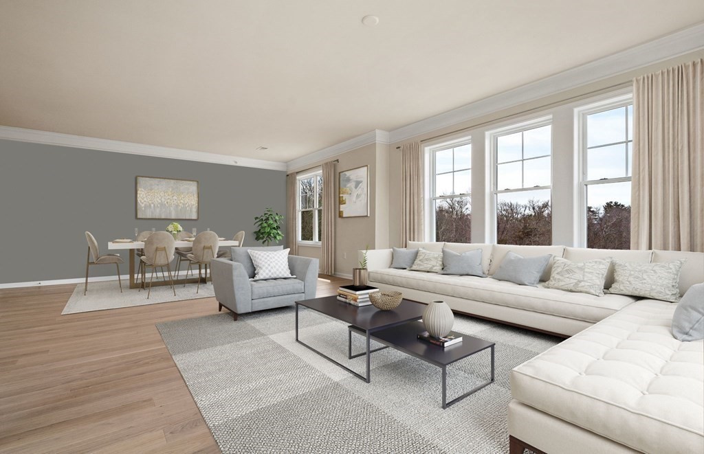 2 Stratton Drive, Unit 305 Woburn, MA 01801 - Photo 4 of 15 a living room with furniture and a large window