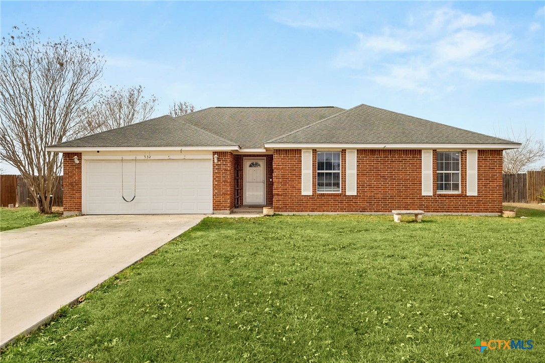 532 Cordova Loop Seguin, TX 78155 - Photo 1 of 1 a view of a yard in front of a house with garage