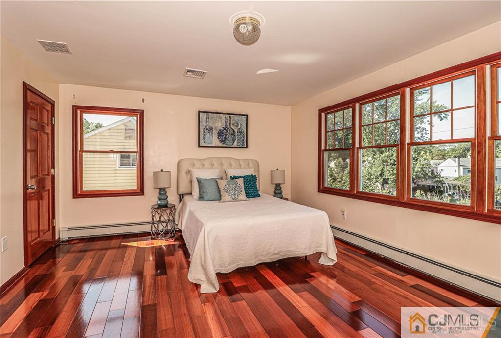 230 McFarlane Road Colonia, NJ 07067 - Photo 24 of 43 a bedroom with a bed and a large window