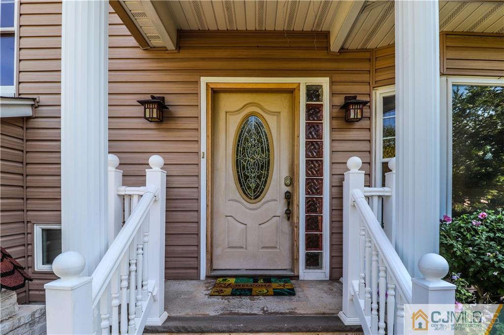 230 McFarlane Road Colonia, NJ 07067 - Photo 3 of 43 a front view of a house with entryway