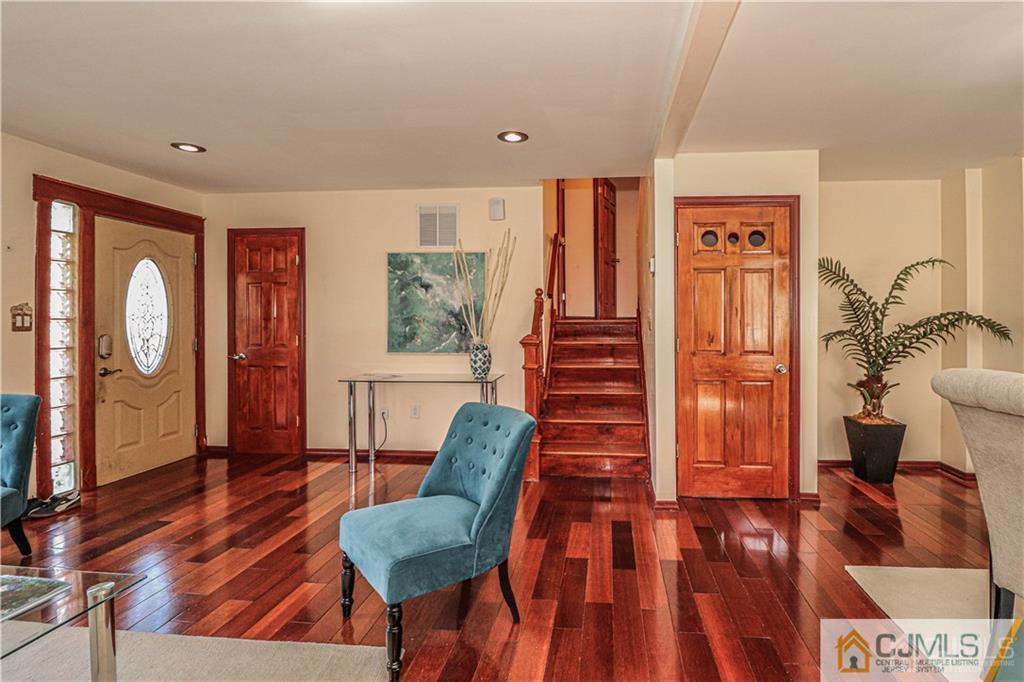 230 McFarlane Road Colonia, NJ 07067 - Photo 7 of 43 a living room with furniture and a wooden floor