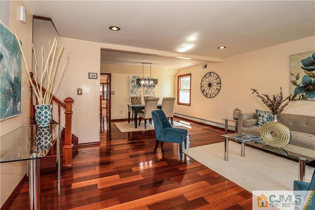 230 McFarlane Road Colonia, NJ 07067 - Photo 10 of 43 a living room with furniture and wooden floor