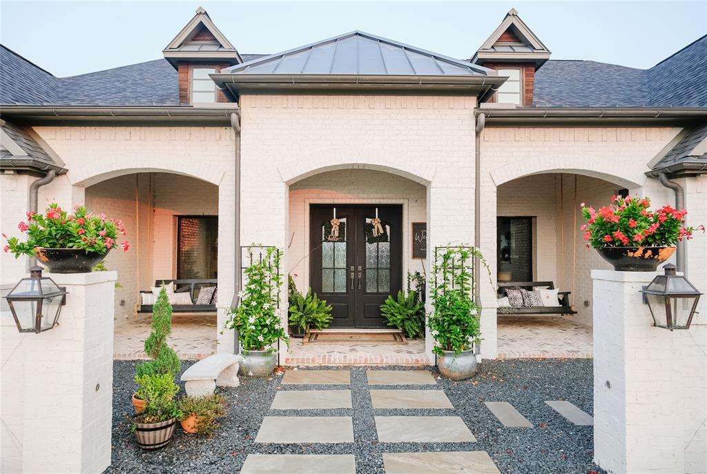 3115 Northgate Celina, TX 75009 - Photo 1 of 1 a front view of a house with potted plants