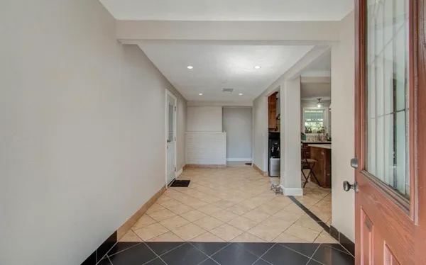 a view of an empty room and window