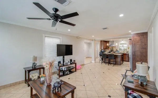 a kitchen with refrigerator and cabinets