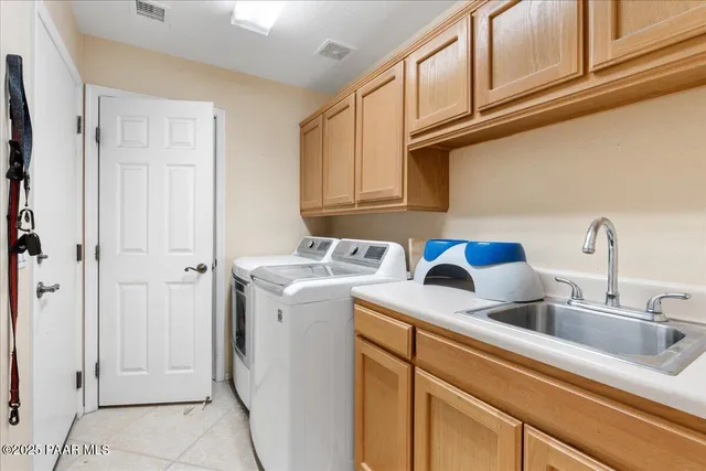 a view of a kitchen sink and a stove top oven