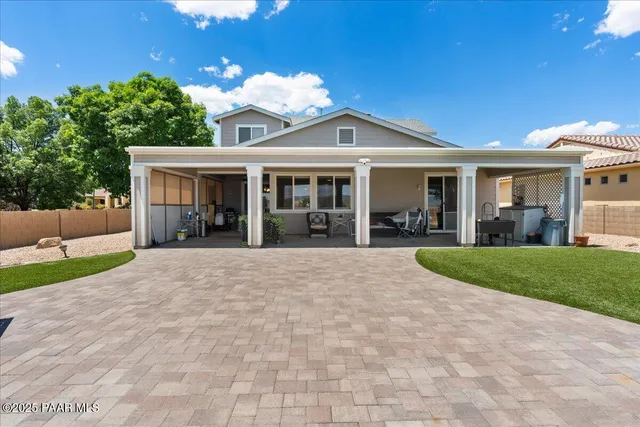 a view of a house with a yard and plants