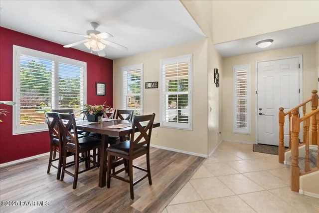 a view of a dining room with furniture and window
