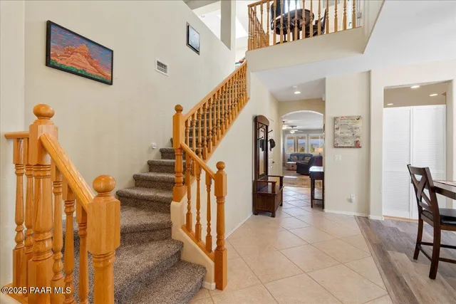 a view of entryway and hall with dining room