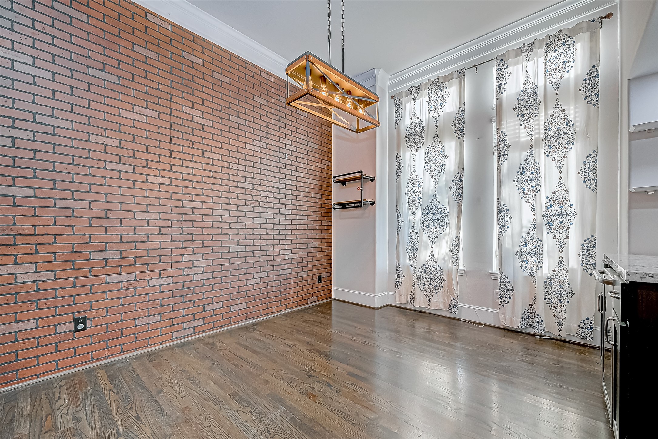 2227 Chenevert Street Houston, TX 77003 - Photo 11 of 24 a view of empty room with wooden floor and fan