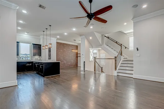 a view of kitchen with cabinets and wooden floor