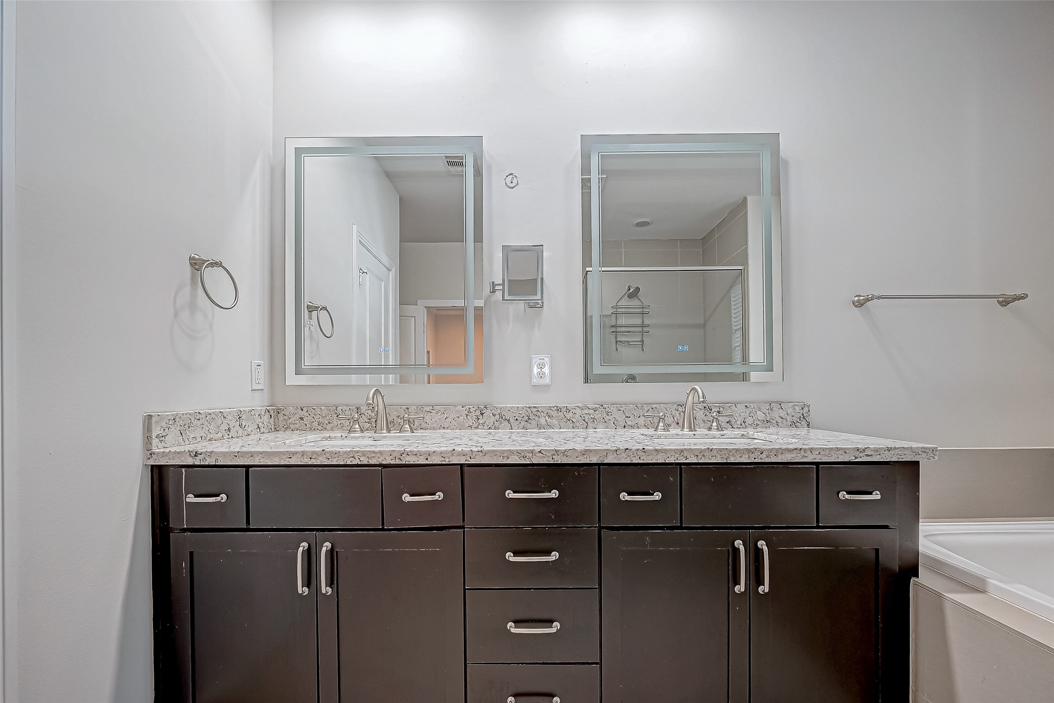 2227 Chenevert Street Houston, TX 77003 - Photo 18 of 24 a bathroom with a granite countertop sink two mirror and a