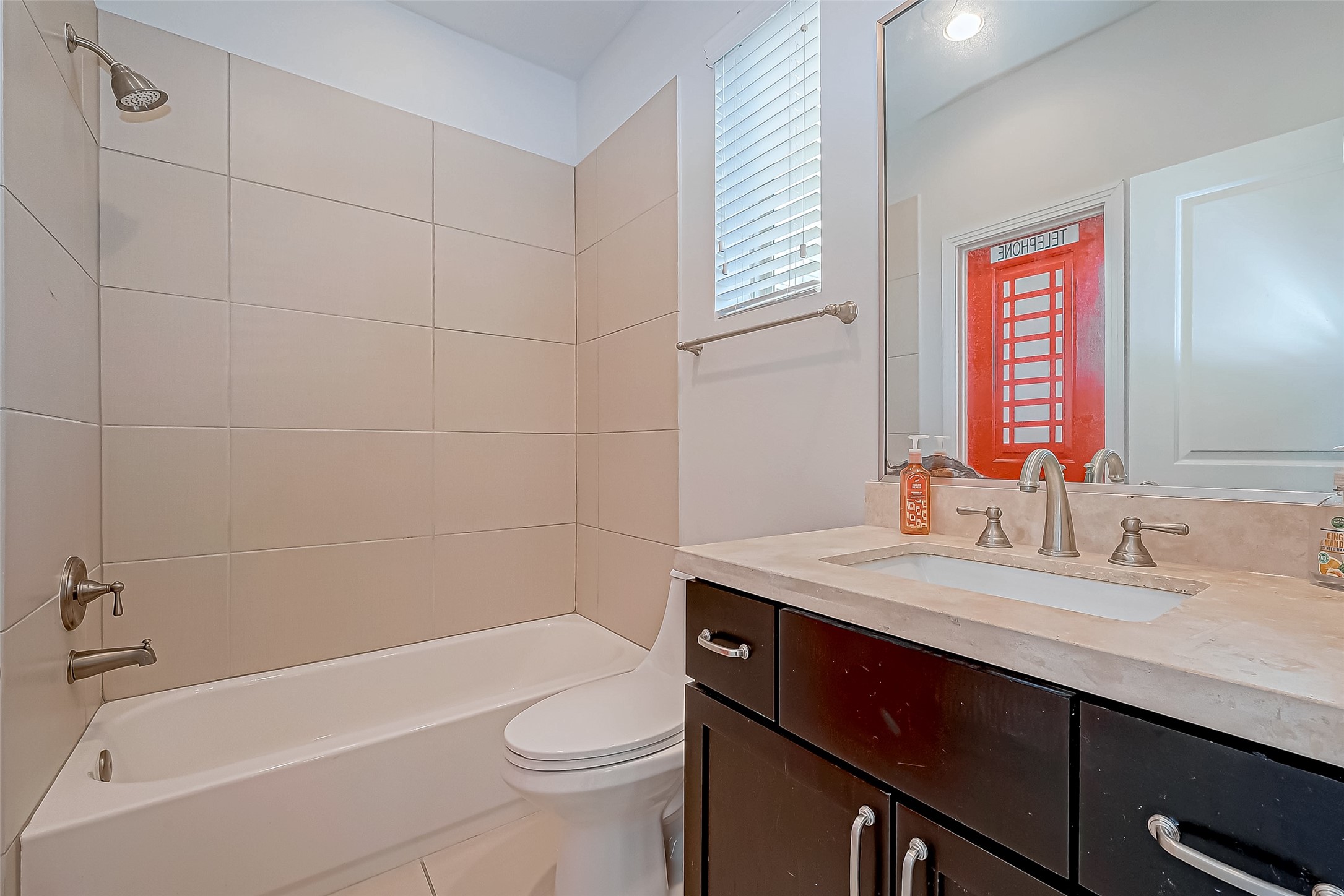 2227 Chenevert Street Houston, TX 77003 - Photo 23 of 24 a bathroom with a sink a toilet and bathtub