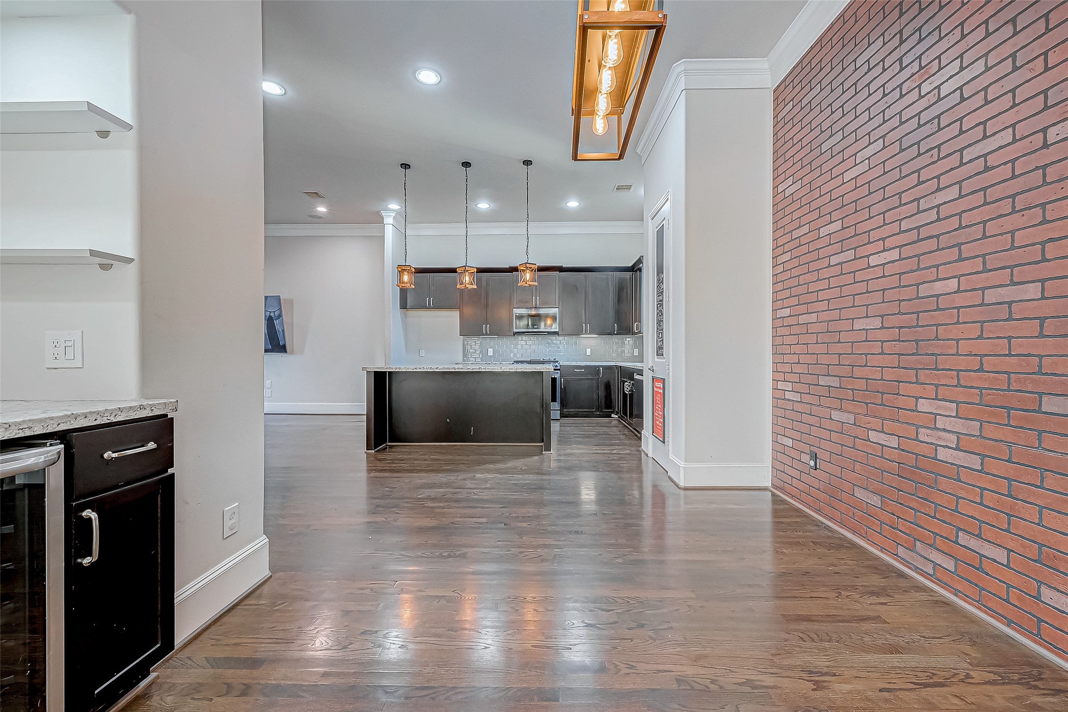 2227 Chenevert Street Houston, TX 77003 - Photo 9 of 24 a large white kitchen with wooden floors