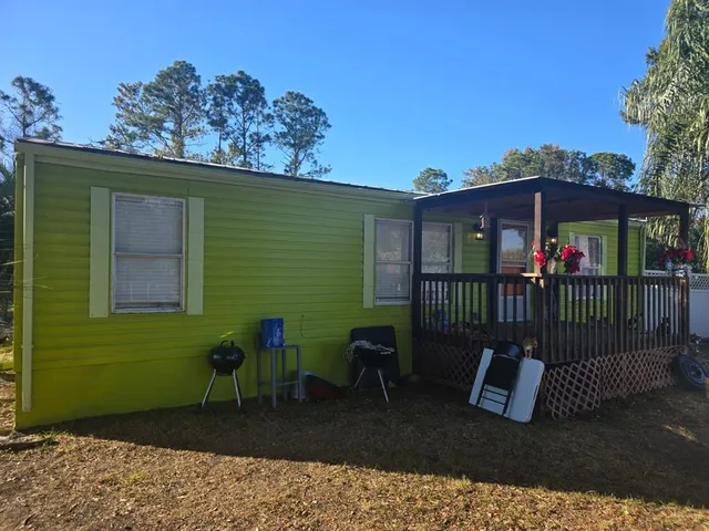a view of a chair and table in the patio