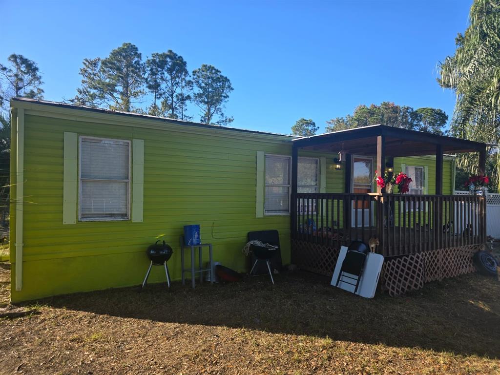 a view of a chair and table in the patio