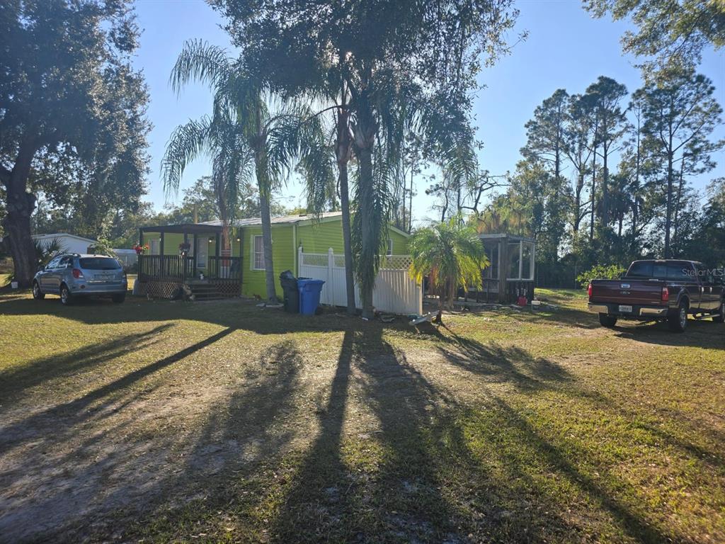 8013 Formby Street Riverview, FL 33578 - Photo 3 of 7 a view of a backyard with a tree