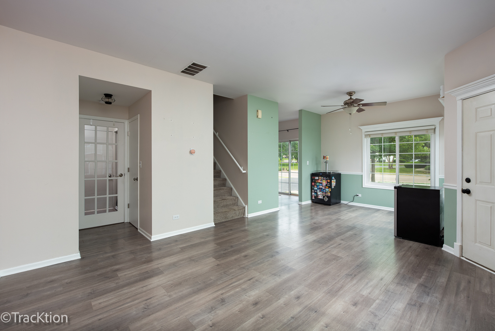 122 Creston Circle, Unit 122 Aurora, IL 60504 - Photo 5 of 22 wooden floor in an empty room with a window