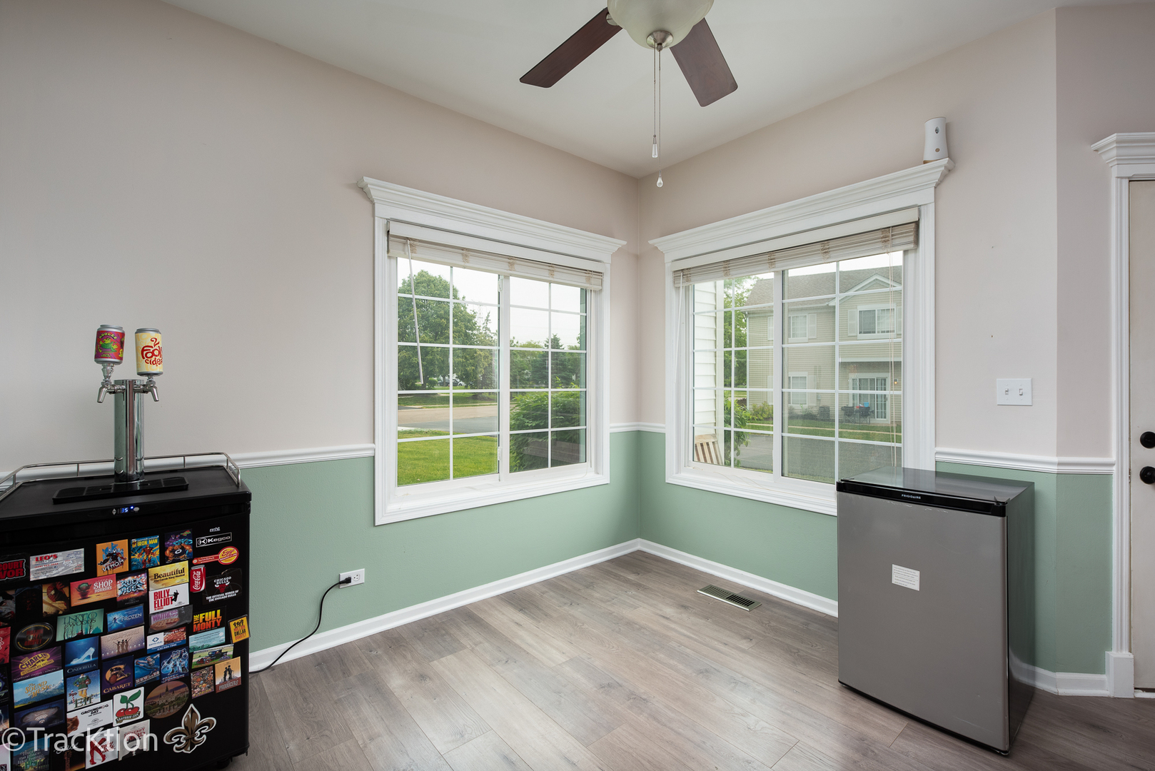 122 Creston Circle, Unit 122 Aurora, IL 60504 - Photo 6 of 22 a view of an empty room with a window and wooden floor