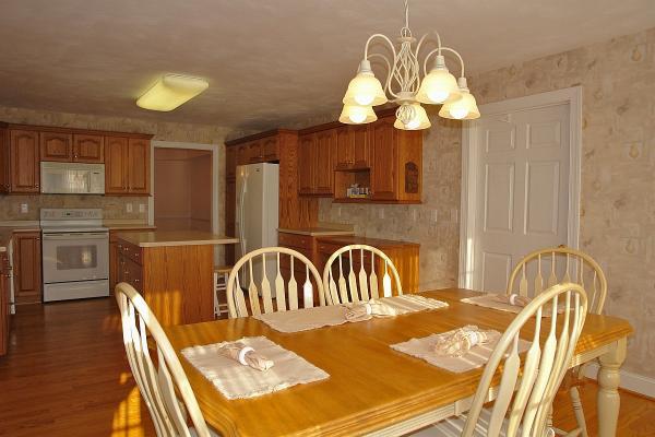 104 Claybrook Court Blue Ridge, VA 24064 - Photo 22 of 74 a view of a dining room with furniture and wooden floor