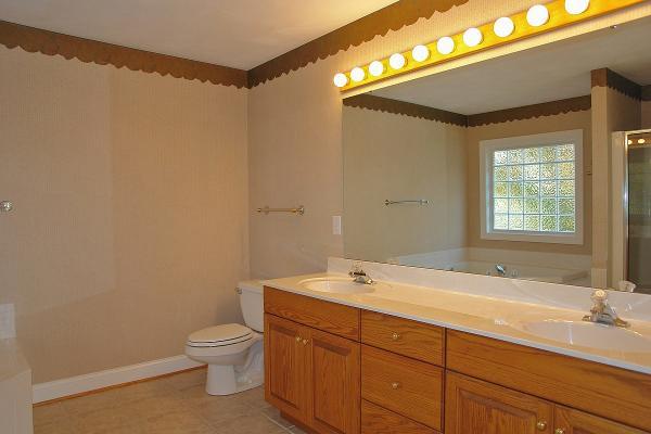 104 Claybrook Court Blue Ridge, VA 24064 - Photo 33 of 74 a bathroom with a granite countertop sink a toilet and a bathtub