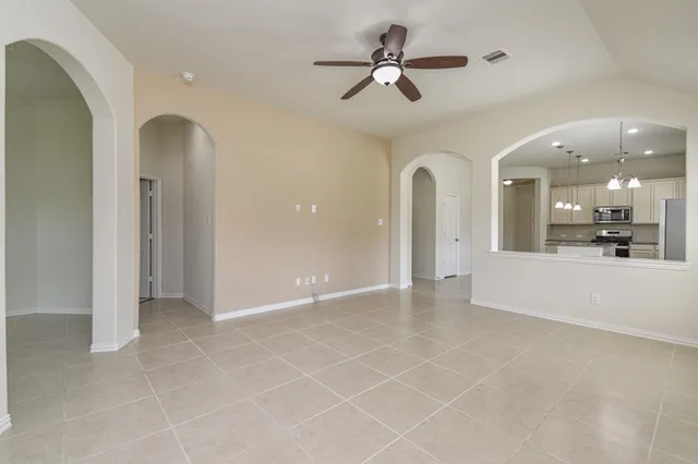 a view of a hallway with chandelier