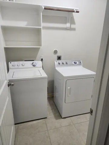 a kitchen with stainless steel appliances granite countertop a sink and a stove