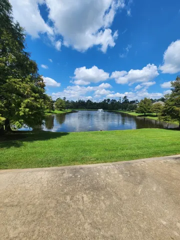 a view of a swimming pool with an outdoor seating