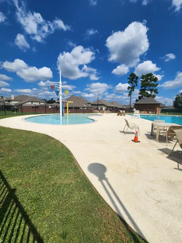 a view of a lake with houses in the back