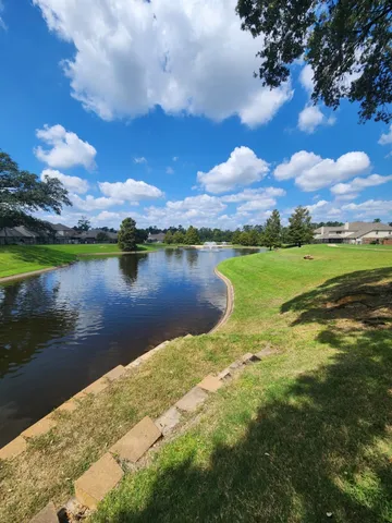 a view of a lake with a big yard