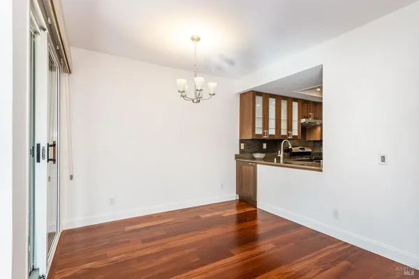 a view of a livingroom with wooden floor