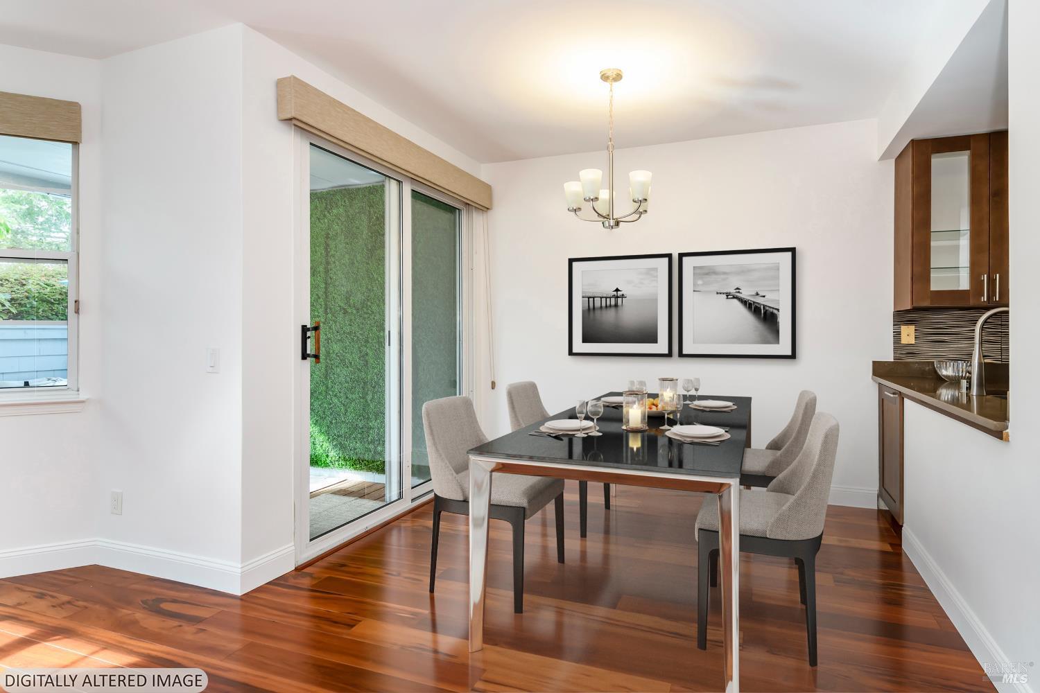 8 Mariners Circle San Rafael, CA 94903 - Photo 3 of 34 a kitchen with a table chairs refrigerator and cabinets