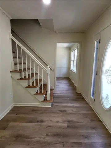 a view of entryway with wooden floor