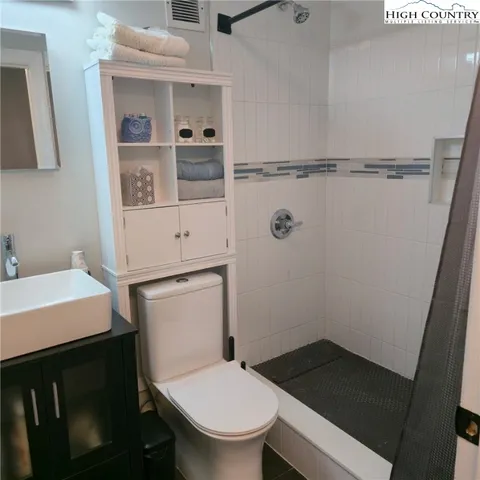 a bathroom with a toilet and a sink