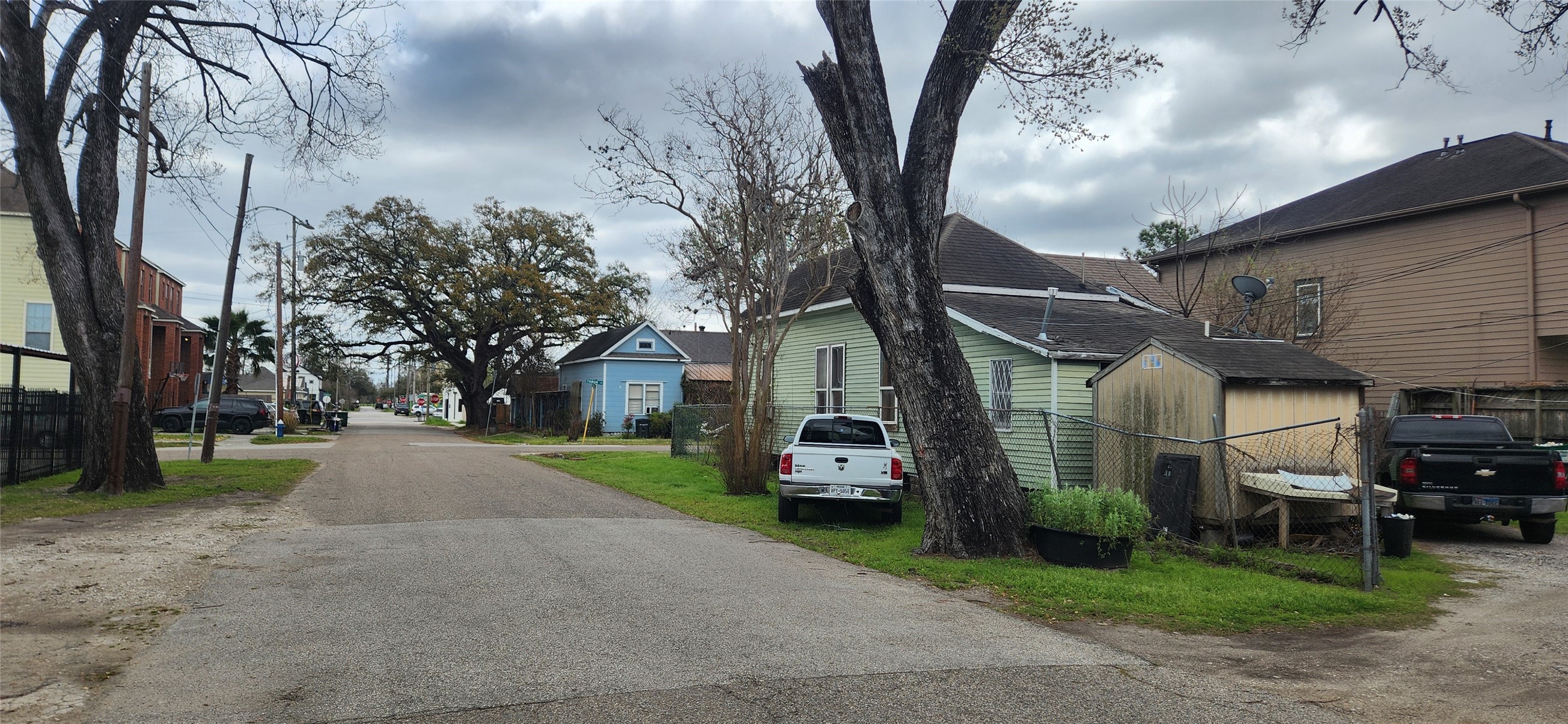 211 Tabor Street Houston, TX 77009 - Photo 7 of 11 a view of a house with a yard and garage