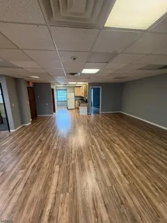 a view of a livingroom with wooden floor