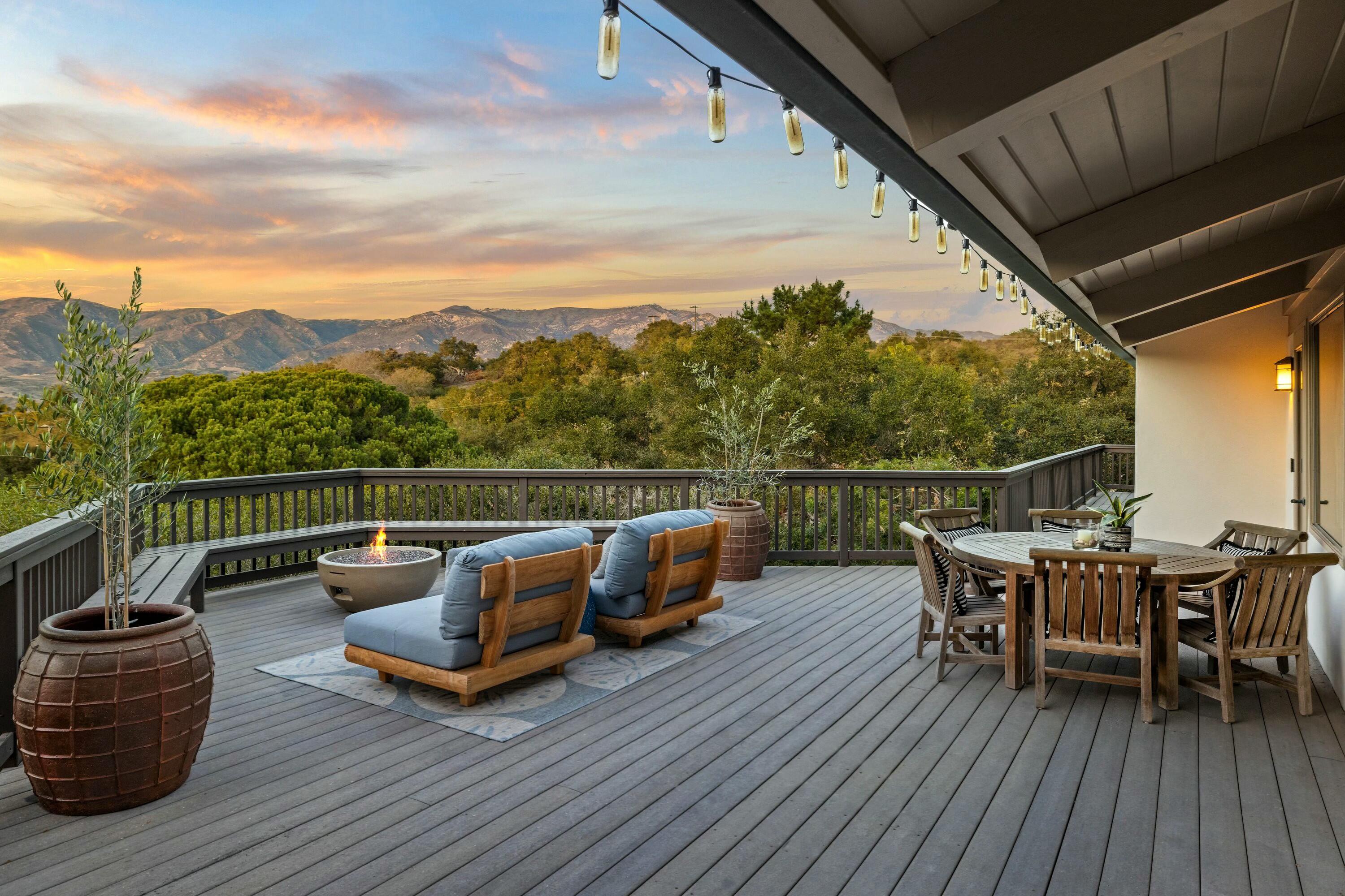 985 Monte Drive Santa Barbara, CA 93110 - Photo 1 of 29 a roof deck with couches and wooden floor