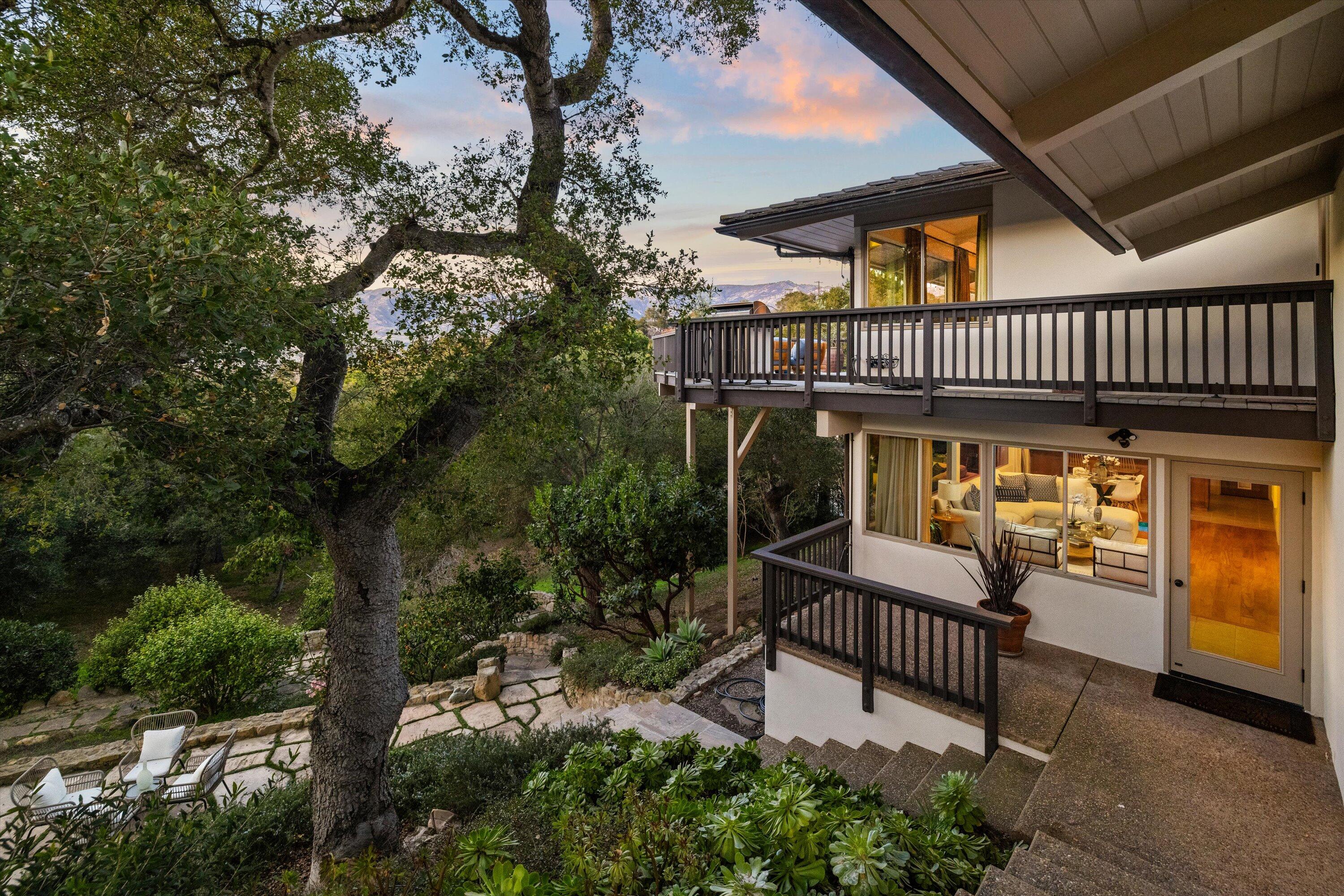 985 Monte Drive Santa Barbara, CA 93110 - Photo 22 of 29 a view of a patio with table and chairs and potted plants