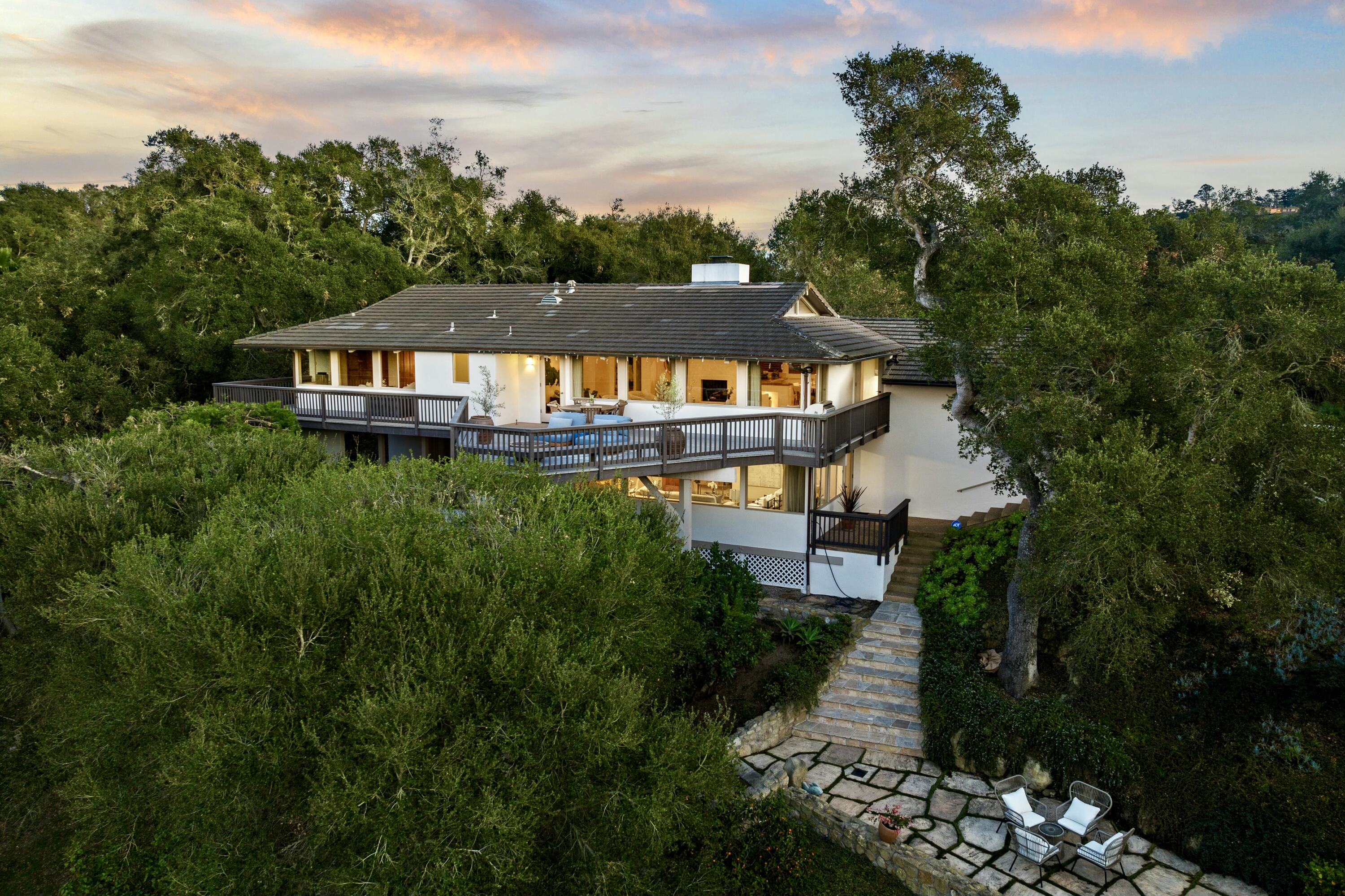 985 Monte Drive Santa Barbara, CA 93110 - Photo 5 of 29 a backyard of a house with table and chairs