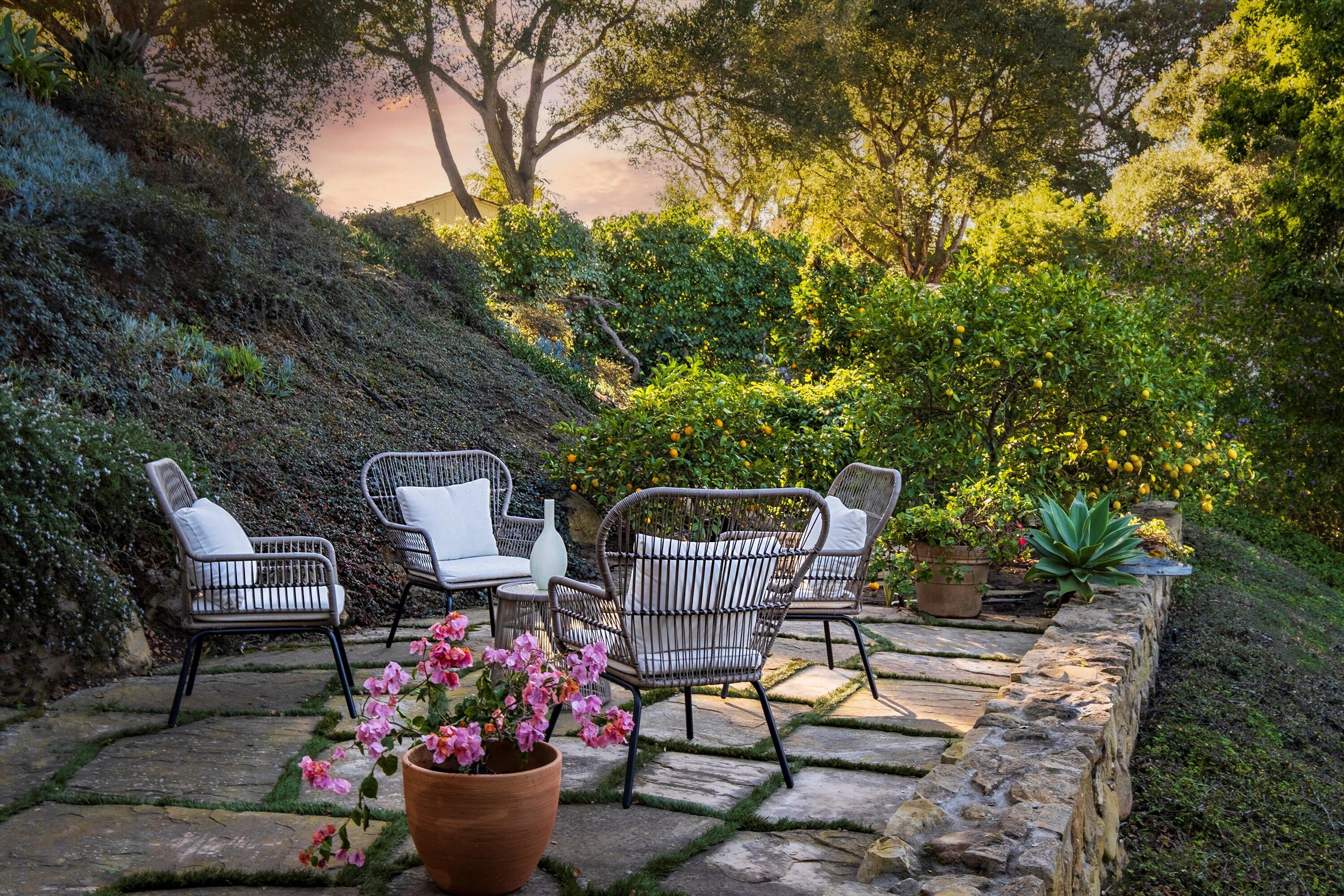 985 Monte Drive Santa Barbara, CA 93110 - Photo 7 of 29 a view of a chairs and table in backyard
