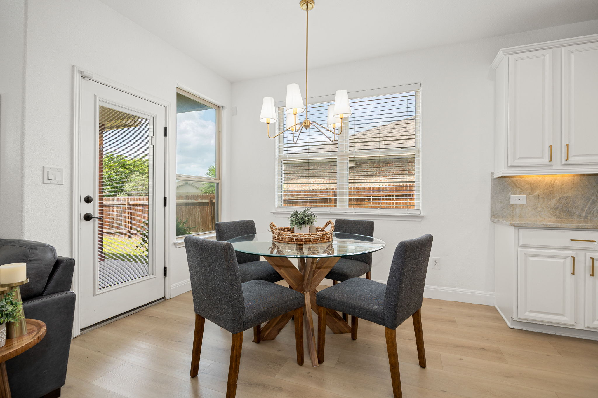 225 Pettigrew Path Buda, TX 78610 - Photo 14 of 38 a view of a dining room with furniture window and wooden floor