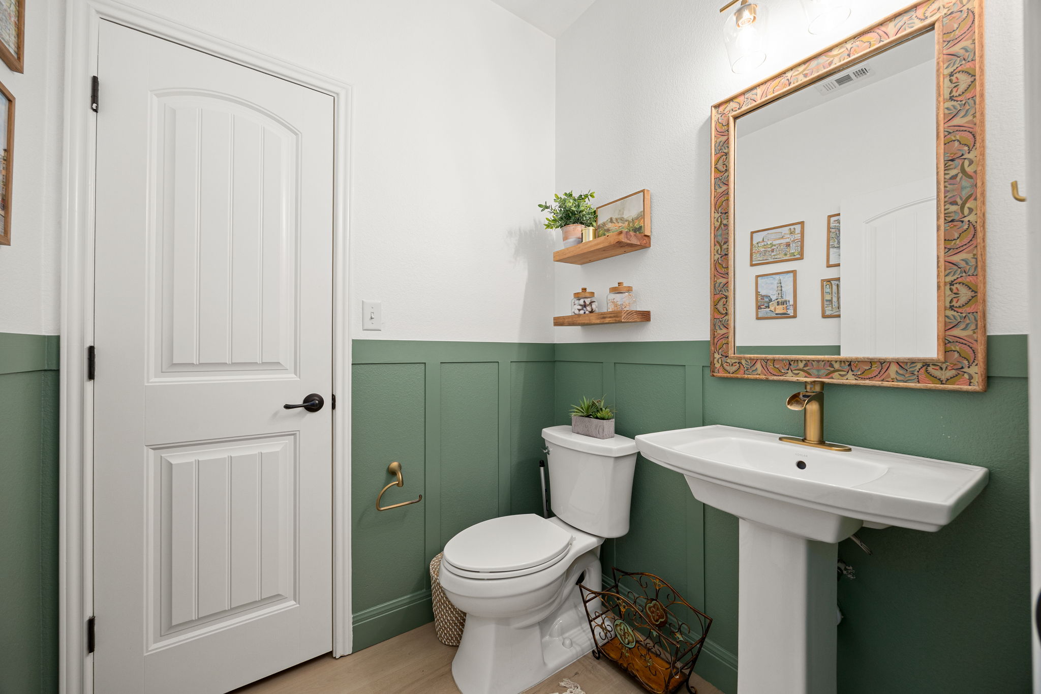 225 Pettigrew Path Buda, TX 78610 - Photo 15 of 38 a bathroom with a sink and mirror