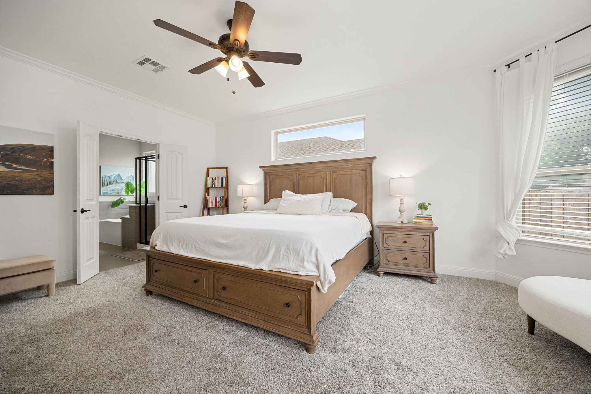 225 Pettigrew Path Buda, TX 78610 - Photo 16 of 38 a bed room with a bed and a window
