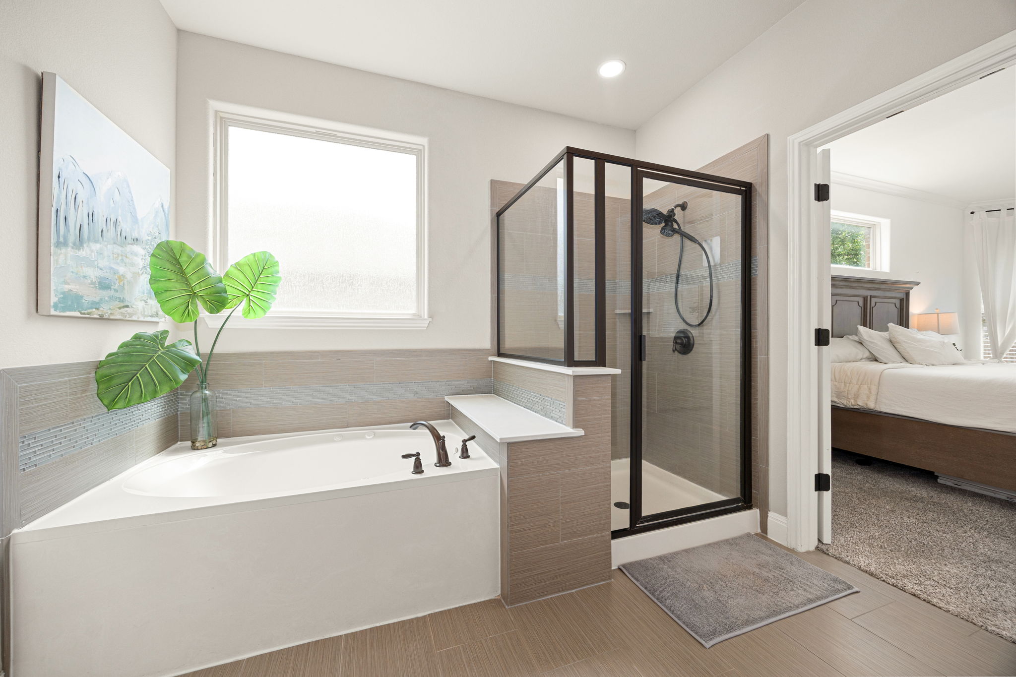 225 Pettigrew Path Buda, TX 78610 - Photo 19 of 38 a spacious bathroom with a tub and a shower