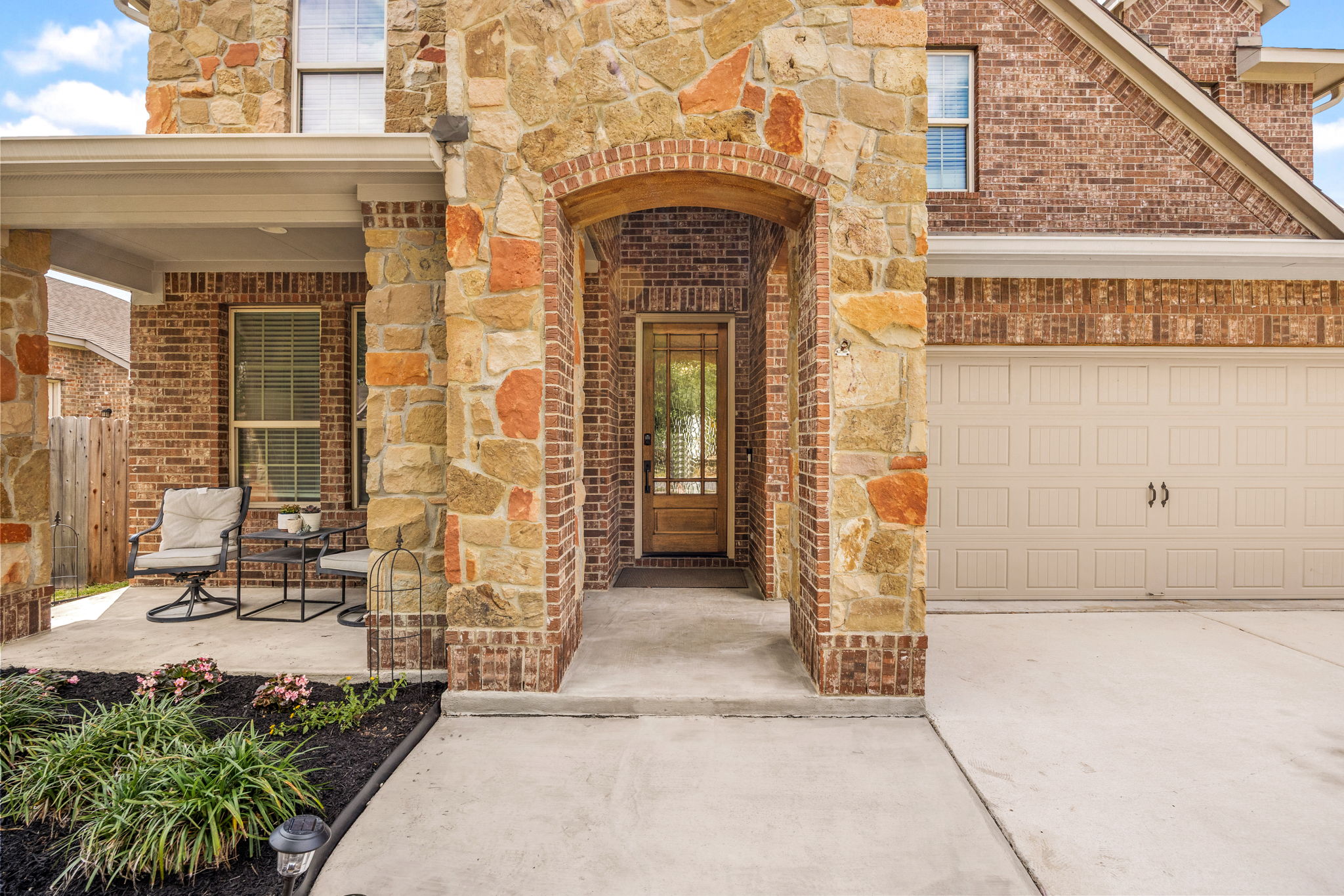 225 Pettigrew Path Buda, TX 78610 - Photo 2 of 38 a view of entrance gate of a building