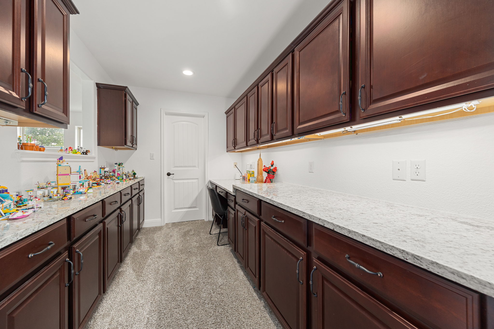 225 Pettigrew Path Buda, TX 78610 - Photo 21 of 38 a kitchen with granite countertop lots of counter top space