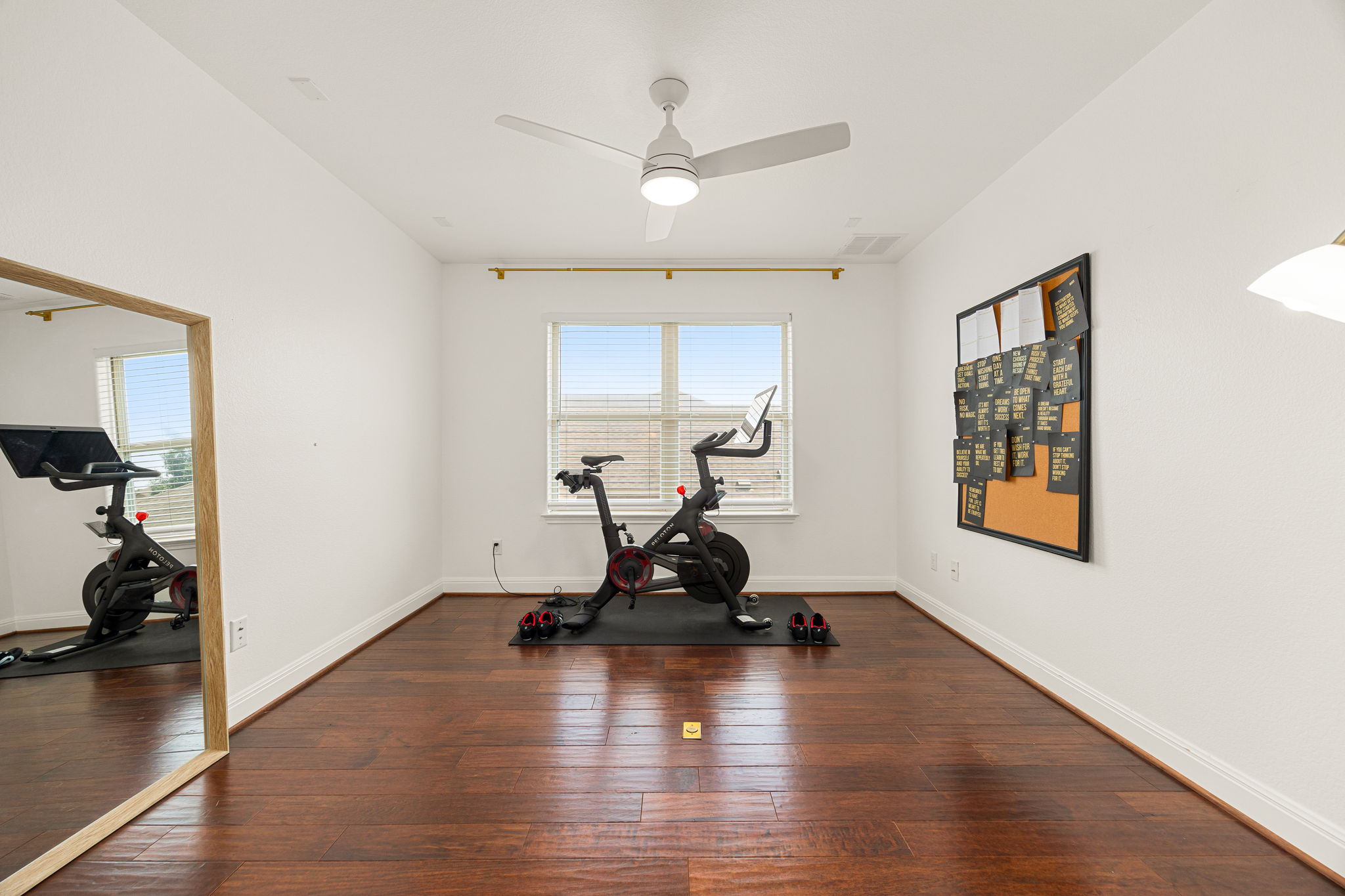 225 Pettigrew Path Buda, TX 78610 - Photo 24 of 38 a living room with hard wood floors