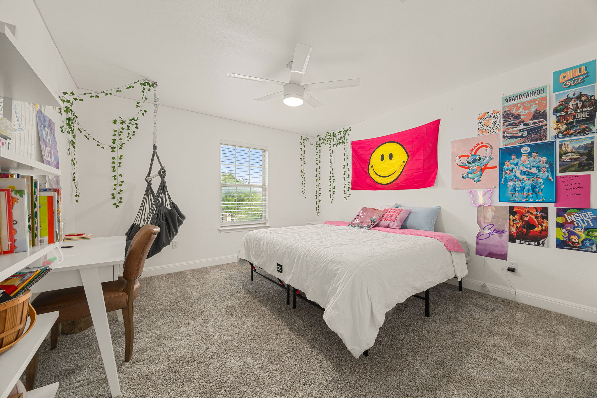 225 Pettigrew Path Buda, TX 78610 - Photo 30 of 38 a bedroom with a bed and a desk