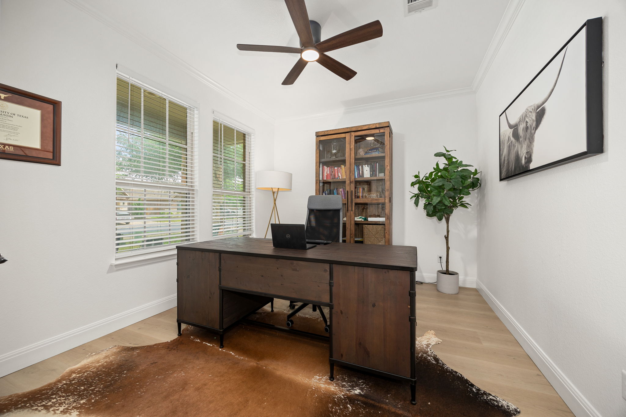225 Pettigrew Path Buda, TX 78610 - Photo 3 of 38 a view of a workspace with furniture and a window